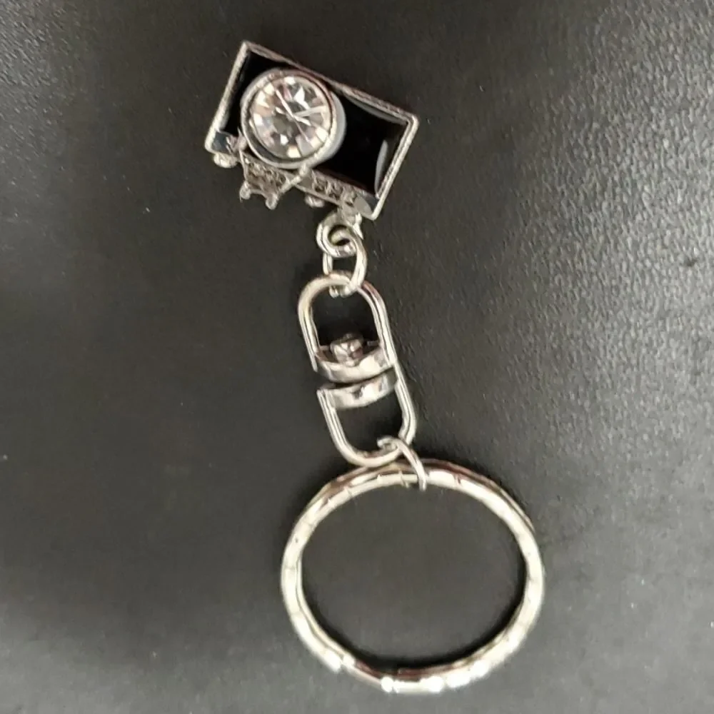 Silver tone camera key fob